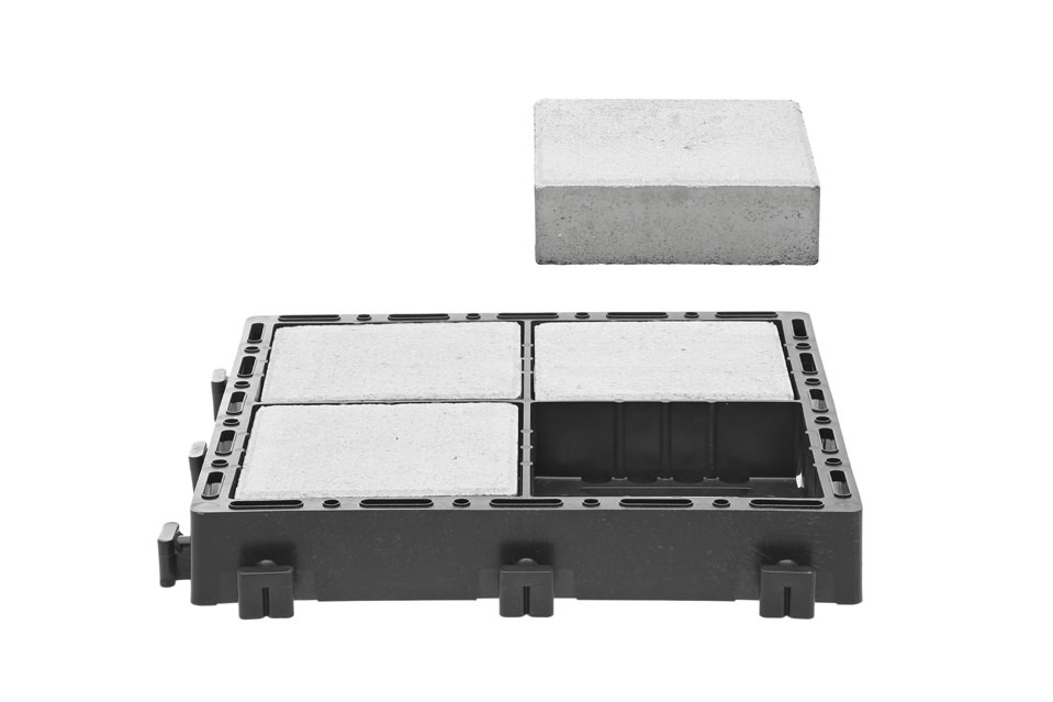 Mockup of Ecoraster Bloxx permeable paver with concrete or stone insert