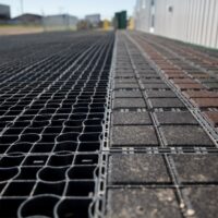 commercial area of permeable paving, both Ecoraster Bloxx and Ecoraster E50, demonstrating their integration abilities