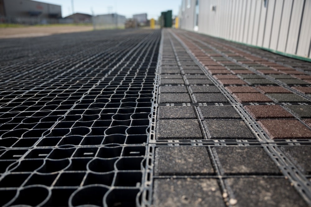 commercial area of permeable paving, both Ecoraster Bloxx and Ecoraster E50, demonstrating their integration abilities