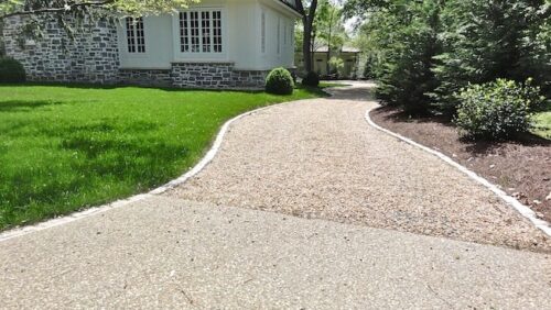permeable pavement driveway filled with beige infill at a cottage
