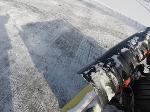 snow plough working on top of Ecoraster permeable paving