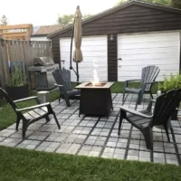Patio chairs with fire pit on top of permeable paver base
