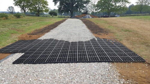 Ecoraster permeable pavers being covered by gravel