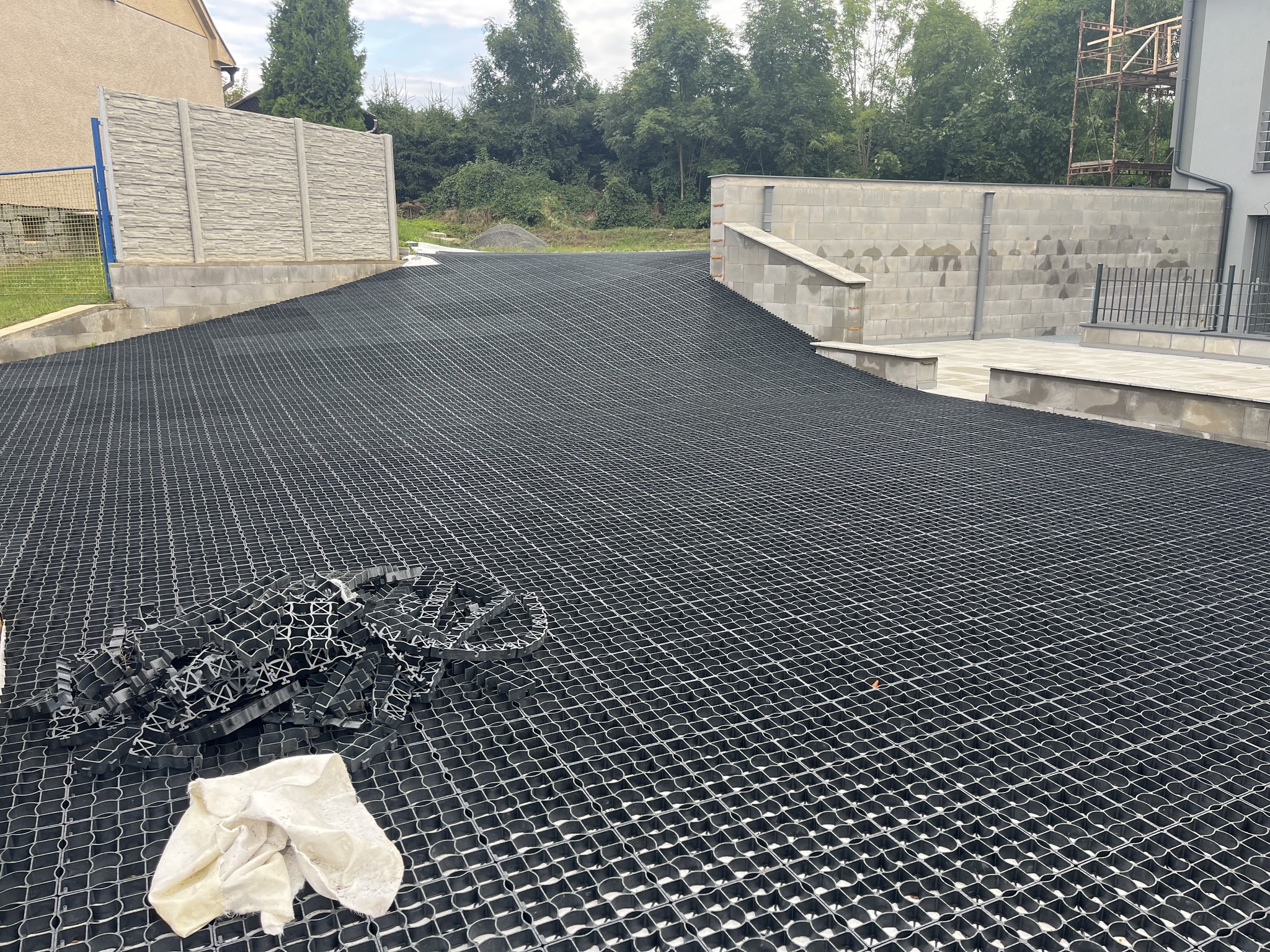 ECORASTER permeable grid being installed across a residential driveway before fill.